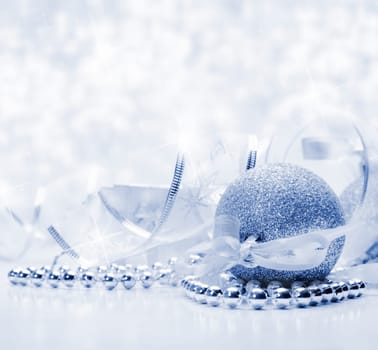 Silver christmas ornaments with bokeh background