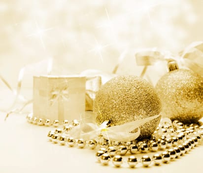 Golden Christmas ornaments with bokeh background