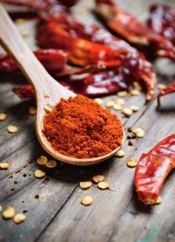 Chilli peppers on rustock wooden plank