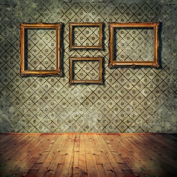 Vintage golden frames on grunge wall