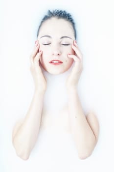 young woman in the bathtub at wellness