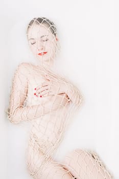 young woman in the bathtub at wellness