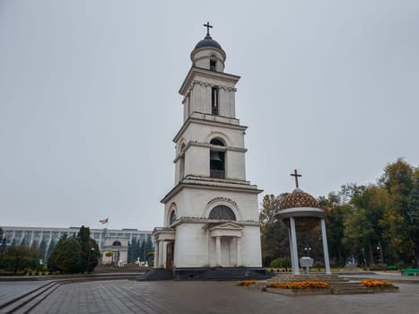 The bell tower near the Metropolitan Cathedral Nativity of the Lord with the view to the Triumphal Arch in Chisinau, Moldova. Historical and architectural landmarks of the capital city
