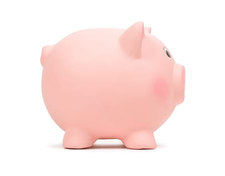 Pink ceramic piggy bank, side view, isolated on white background