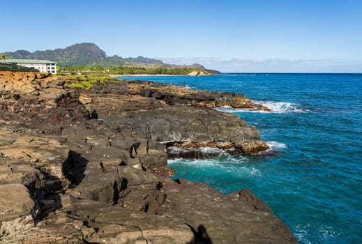 Aerial view of Keoniloa Bay and Shipwreck beach in Koloa on south coast of Kauai