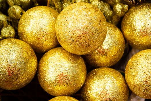 Christmas tree balls decoration golden background, close up