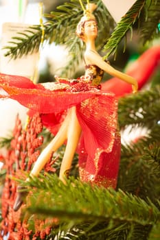 Christmas ballerina figures on New Year fur tree close up Christmas concept