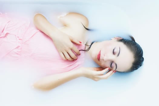 young woman in the bathtub at wellness