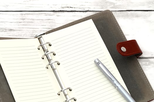 Close up of opened notebook and fountain pen