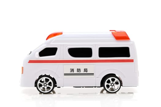 Japanese toy ambulance car isolated on white background, Translation: "Fire department"""