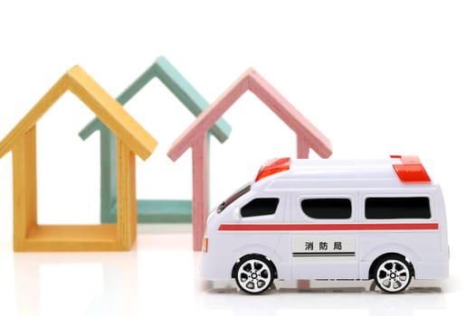 Japanese toy ambulance car isolated on white background, Translation: "Fire department"""