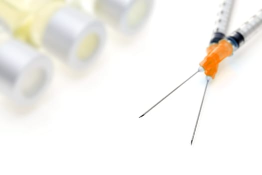 medical disposable syringe with vaccine bottle on white background