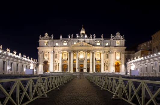 Papal Basilica of Saint Peter in  Vatican City illuminated by night, designed by Michelangelo and Bernini
