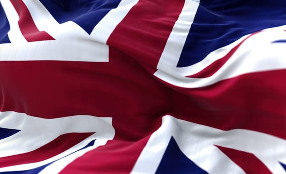 The national flag of the United Kingdom flying in the wind. Outdoors and sky in the background.