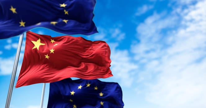 The flags of China and the European Union waving. International relations and diplomacy.