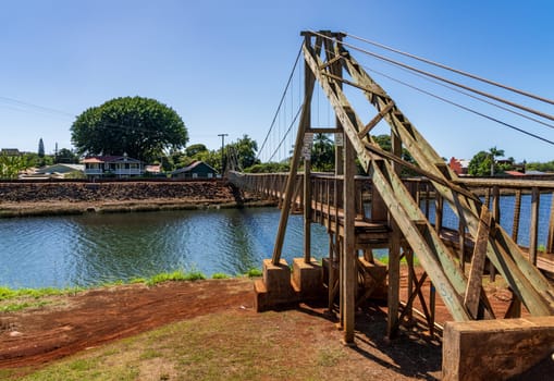 Structure of the historic wooden swinging bridge across the river in Hanapepe, Kauai