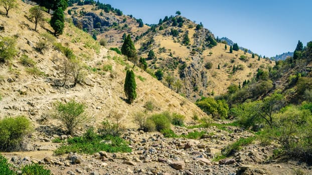 Dry river bed and a trail in Hissar Valley in Tajikistan