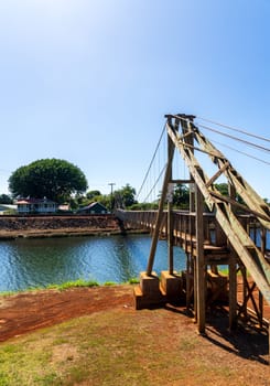 Structure of the historic wooden swinging bridge across the river in Hanapepe, Kauai