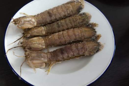 steamed crayfish or mantis shrimps or stomatopods   on white plate