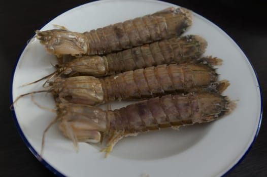 steamed crayfish or mantis shrimps or stomatopods   on white plate
