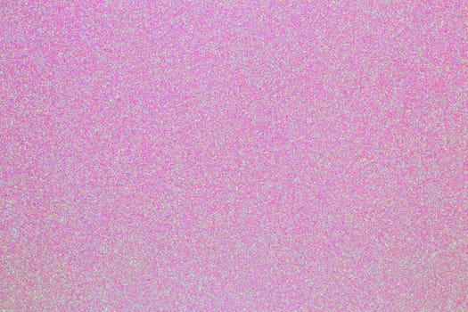 Pink glitter texture. Close-up of a light pink background with pink color sparkle. Macro.