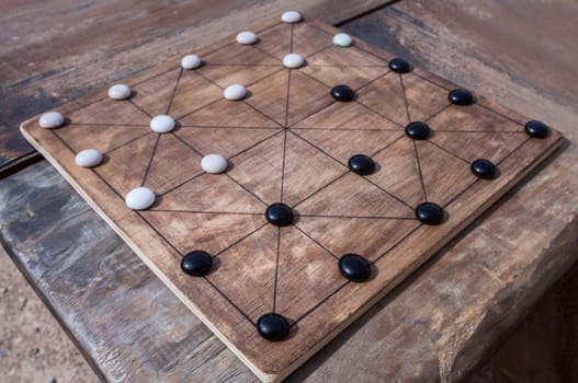 Alquerque, also known as Qirkat. Strategy board game originated in the Middle East