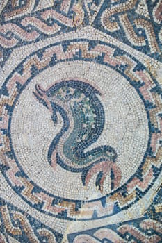 Merida, Spain - Dec 12th, 2020: Dolphin mosaic. Amphitheatre House of Merida. Extremadura, Spain