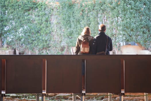 Merida, Spain - Dec 12th, 2020: Couple visiting Amphitheatre House of Merida. Extremadura, Spain