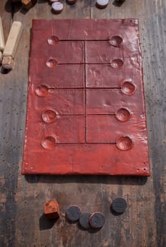 Reconstruction of greek and roman board game Pente Grammai. Private recreational activity of ancient romans