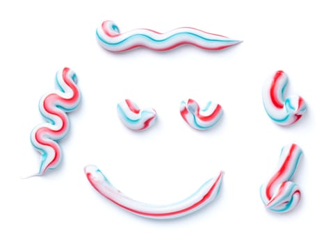 Set of striped toothpaste isolated on white background. Top view