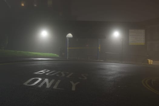 Sheffield, United Kingdom, 8th November, 2020: NHS Hallamshire hospital bus stop, beech hill road or glossop road. Night time lights with heavy fog