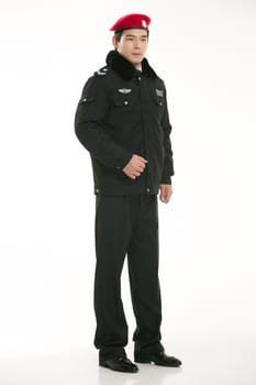 Create all kinds of work clothes policeman stands in front of a white background