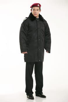 Create all kinds of work clothes policeman stands in front of a white background