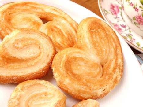Puff pastry cookies on a white plate