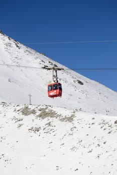 Mountains in winter with cable car