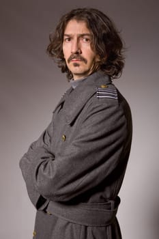 young man dressed as russian military, studio picture