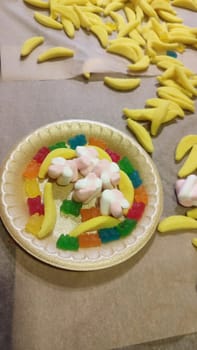 children sweet candy dessert food plate colorful delicious. High quality photo vertical format image