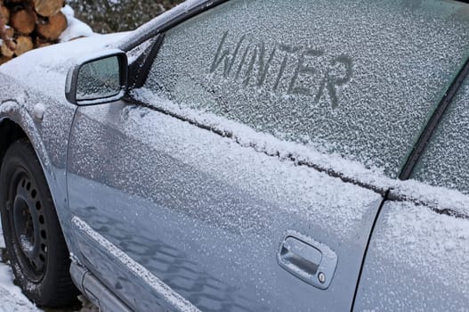 Winter on the road. A car full of snow and ice