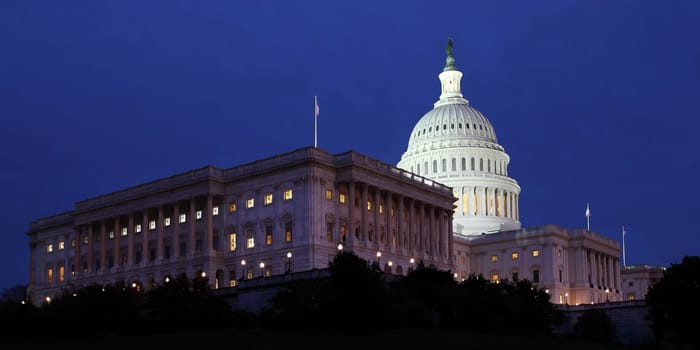 The US Capitol Building at night Washington DC