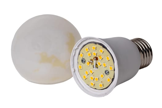 Defective bulbs. Close-up of an exploded led lamp with burn marks on the plus and minus connecting wires isolated on a white background. Clipping path. Macro.