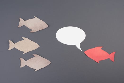 Fish with speech bubble, communication, having a discussion, sending a message, copy space, grey background