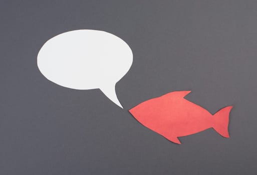 Fish with speech bubble, communication, having a discussion, sending a message, copy space, grey background
