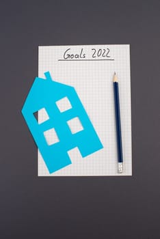 Empty paper, pen, house, goals for 2022, making plans, home buyer, concept