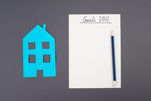Empty paper, pen, house, goals for 2022, making plans, home buyer, concept