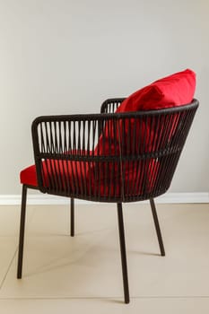 Contemporary wicker kitchen armchair with velour upholstery.