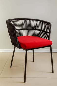 Contemporary wicker kitchen armchair with velour upholstery.