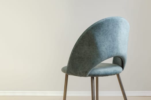 Contemporary modern kitchen armchair with velour upholstery. Copy space