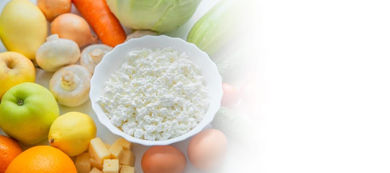 Fruits, vegetables and dairy products lie next to each other with a place for text. High quality photo