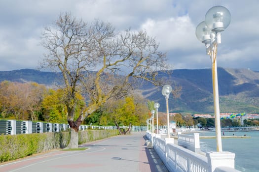 The embankment of the resort gelendzhik, you can see the asphalt path, lanterns, fencing and the sea. High quality photo