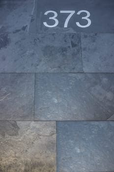 House number 373. Silver over black-blueish slate. Houses with personality concept